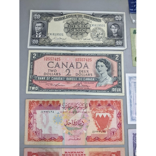 379 - Mixed banknotes from around the world to include a 1973 Hong Kong and Shanghai Banking corporation T... 