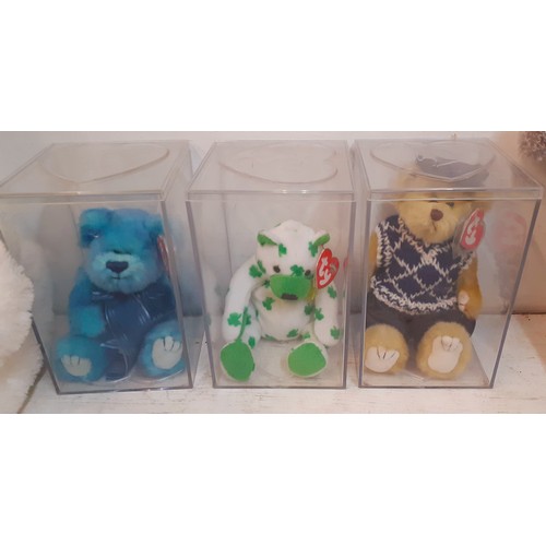 327 - A collection of soft toys to include three Ty Beanie Babies in Perspex boxes, a Harrods 2004 bear, a... 