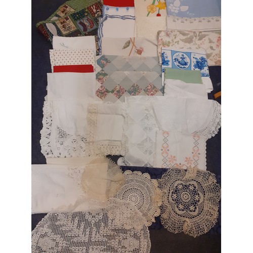 122 - A quantity of vintage table linen, mainly 1970's together with 1970's woollen crotchet throws to inc... 