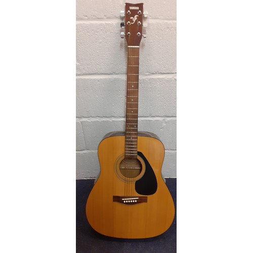 195 - A Yamaha F-310 6-string acoustic guitar with soft padded case.
Location: RWF