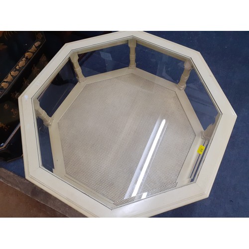 375 - A reproduction octagonal two tier coffee table with a glass top Location: RAB