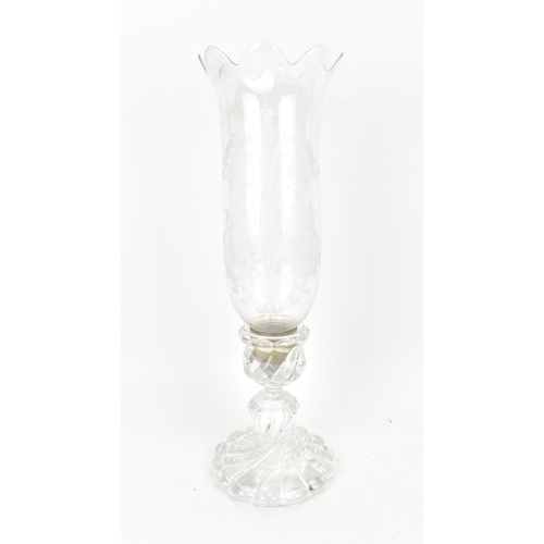 174 - A Baccarat hurricane candlestick, the U-shaped removable shade with acid etched acanthus scrolls, on... 