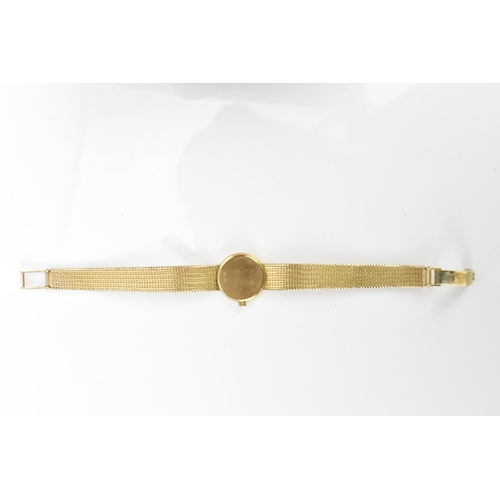 19 - An Omega, quartz, ladies, 9ct gold wristwatch, having a gilt dial with baton markers and integral me... 
