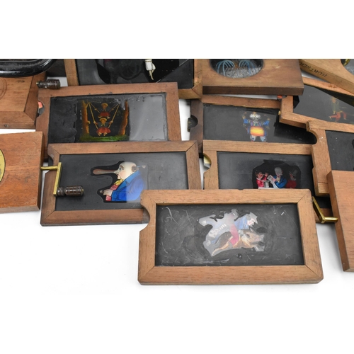 205 - A collection of mechanical and sliding magic lantern slides, of various subjects such as jester danc... 