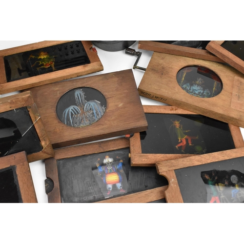 205 - A collection of mechanical and sliding magic lantern slides, of various subjects such as jester danc... 