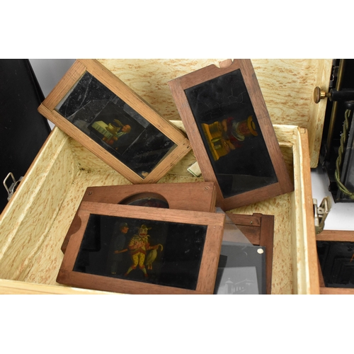 205 - A collection of mechanical and sliding magic lantern slides, of various subjects such as jester danc... 