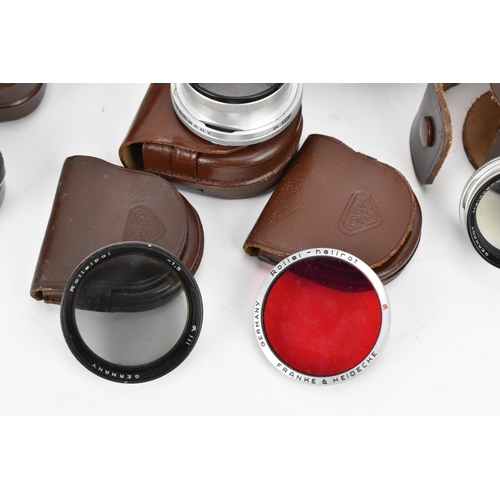 238 - A collection of Rollei lenses and filters, to include bay III lens filters in a leather case, UV-fil... 