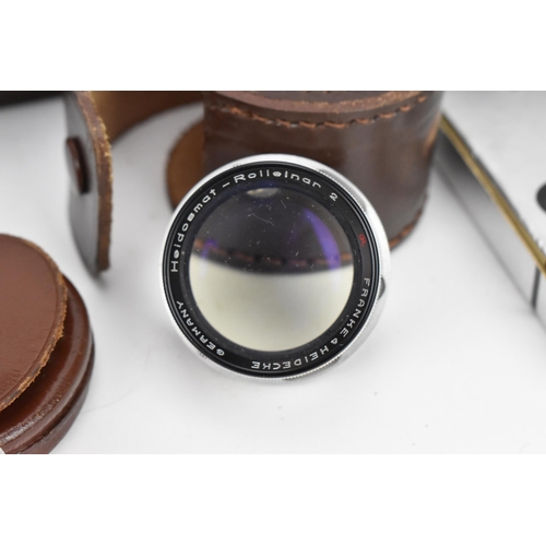 238 - A collection of Rollei lenses and filters, to include bay III lens filters in a leather case, UV-fil... 