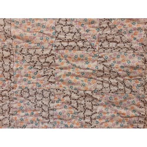 464 - A mid 20th Century American Mid West double layer handmade patchwork quilt in 2 floral patterns on a... 