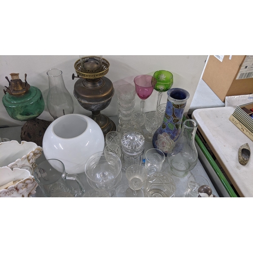 360 - A mixed lot to include Victorian oil lamps, Tiffany Portuguese cup and saucer, hock glass and other ... 