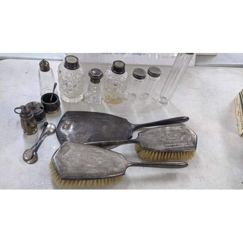 370 - A mixed lot of silver to include dressing table brushes, jars, and other items Location: