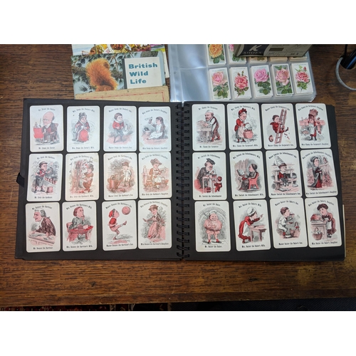 388 - Cigarette cards and tea card books and loose cards and in plastic wallets with French game cards Loc... 