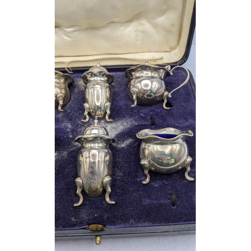 428 - A six piece condiments hallmarked Birmingham 1918, total weight excluding glass 226g, box A/F
Locati... 