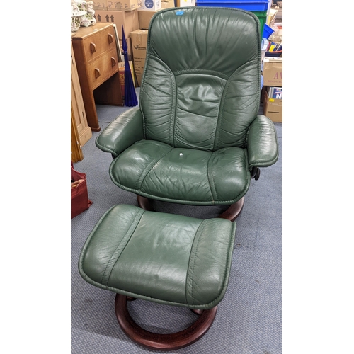 491 - A Ekornes stressless green leather armchair with matching footstool
Location:A2M