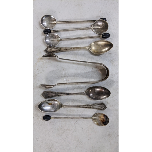 502 - Mixed silver to include sugar tongs, coffee bean spoons, and teaspoons, 86.6g Location:A3T