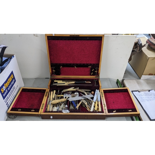 503 - An Edwardian mahogany canteen of mixed silver plated cutlery having an inset brass plaque and boxwoo... 