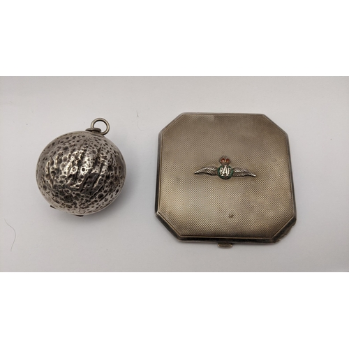 505 - A 19th century silver walnut shaped pendant, together with a silver plated RAF compact Location:CAB8