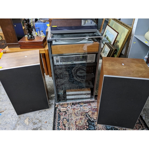 431 - A stereo system comprising a Bang and Olufsen Beogram Rx2 turntable, a Goldring Lenco GL75 turntable... 