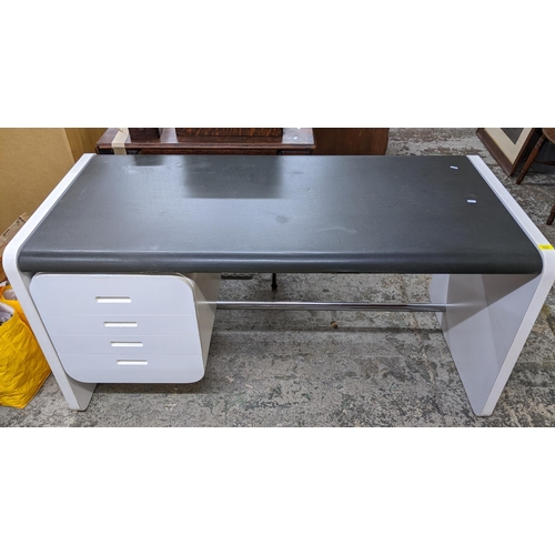 433 - An Art Deco style kneehole desk, white finished effect, black leatherette top over four side drawers... 