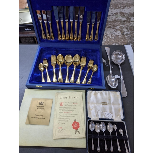 443 - A Bestecke Solingen chrome nickel steel cutlery set with gilt handles, cased set of four Edwardian s... 