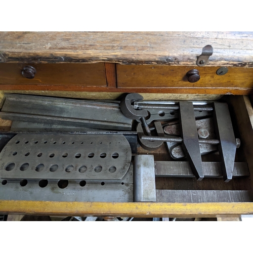 298 - An oak engineer's tool chest with two short and three long drawers with sliding front, containing va... 