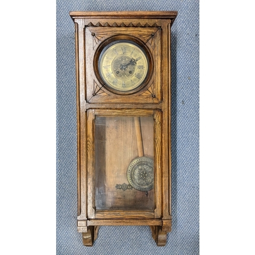 515 - An early 20th century oak cased 8-day wall hanging clock striking on a gong, 93.5cm h x 39cm w
Locat... 