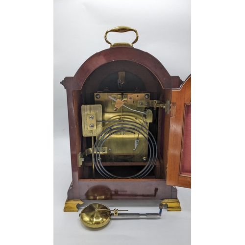 109 - A circa 1900 Payne & Co mahogany 8 day bracket clock, the arched top case having pierced grille side... 