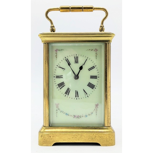 111 - An early 20th century French brass carriage clock, the dial painted with floral swags and having bla... 