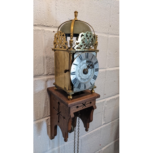 115 - An 18th century and later lantern clock, the four post case with 6