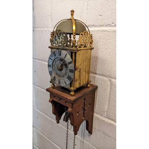 115 - An 18th century and later lantern clock, the four post case with 6