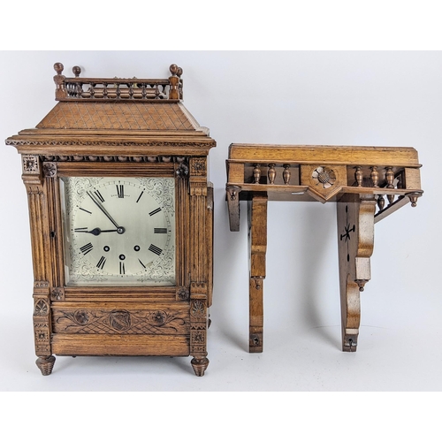 116 - A late 19th century oak bracket clock, the case of architectural design having a handle to the top e... 