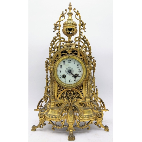 53 - A late 19th century French gilt metal mantle clock, the case having pierced scroll design with singl... 