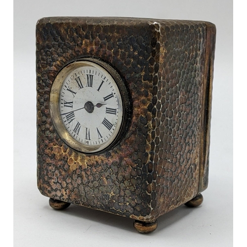 54 - An Edwardian Asprey silver dressing table clock, the case having hammered decoration, initialled 'E.... 