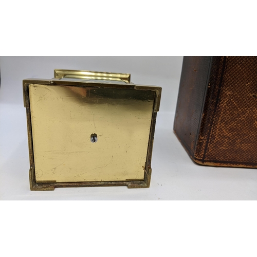 55 - An early 20th century brass cased repeater carriage clock, the white enamel dial having Roman numera... 