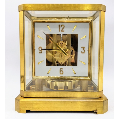 59 - A Jaeger Le Coultre Atmos clock circa 1960s, in a gilt brass case, having a square cream chapter rin... 