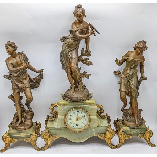 65 - A late 19th century French clock with matching garnitures, the onyx and gilt case having gilt metal ... 