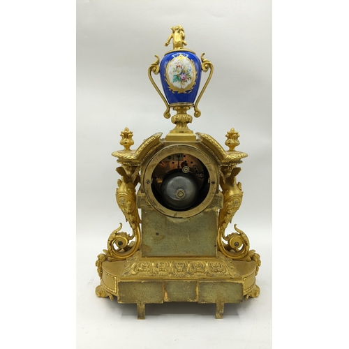 66 - A 19th century French gilt bronze mantle clock, the case having Sevres style porcelain panels, urn f... 