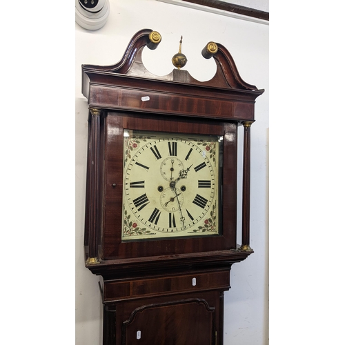 69 - An early 19th century mahogany longcase clock, the case having a gilt metal ball finial, string inla... 