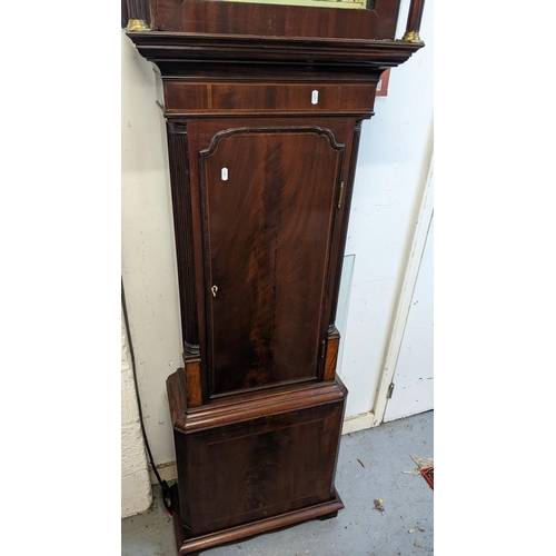 69 - An early 19th century mahogany longcase clock, the case having a gilt metal ball finial, string inla... 