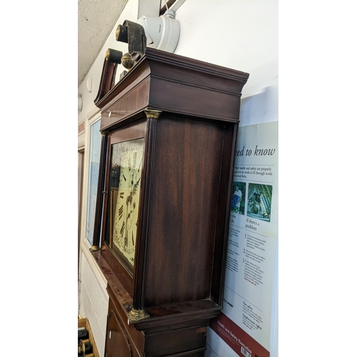 69 - An early 19th century mahogany longcase clock, the case having a gilt metal ball finial, string inla... 