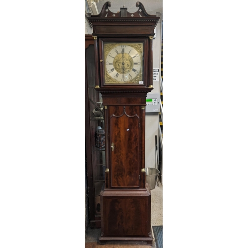 70 - A George III mahogany longcase clock, the case having a broken swan neck pediment above a dental mou... 