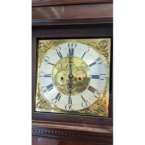 70 - A George III mahogany longcase clock, the case having a broken swan neck pediment above a dental mou... 