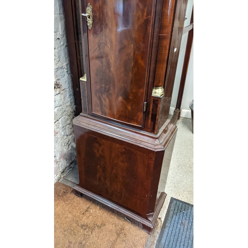 70 - A George III mahogany longcase clock, the case having a broken swan neck pediment above a dental mou... 