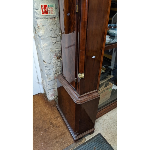 70 - A George III mahogany longcase clock, the case having a broken swan neck pediment above a dental mou... 