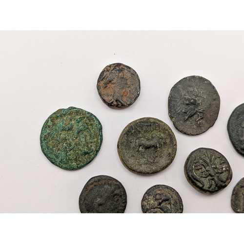 144 - Ancient Greece - A group of nine bronze coins to include, Helmeted head of Athena in crested Corinth... 