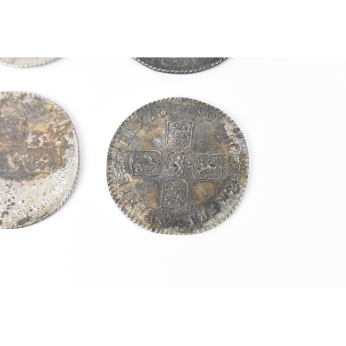 196 - Wreck coins - reputedly H.M.S Association - William III (1689-1702), Shillings, a group of four date... 