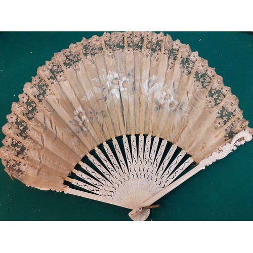 145 - A mixed lot comprising an Edwardian cream silk fan A/F, an early 20th Century cream silk beaded even... 