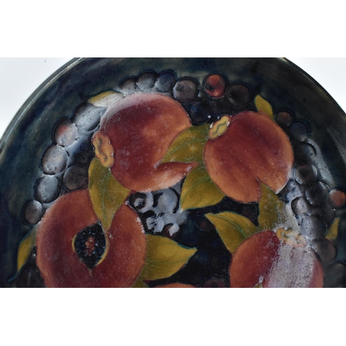 260 - A William Moorcroft (1872-1945) pottery bowl in the 'Pomegranate' pattern, circa 1935, of circular f... 