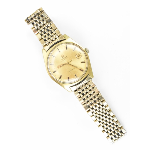 17 - An Omega, automatic, gents, gold plated vintage wristwatch, having a gilt dial with baton markers, c... 