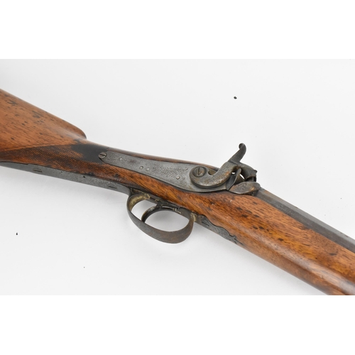 204 - A percussion single barrel rifle, with walnut stock, steel trigger guard, and metal ramrod with copp... 